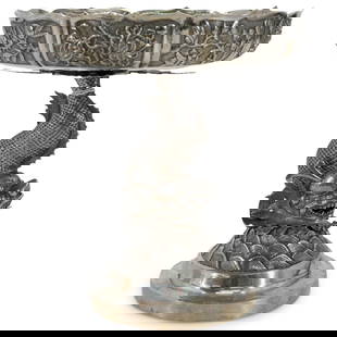 Antique Chinese Export Silver Chiwen Dragon Fish Tazza: DESCRIPTION: Antique Chinese export tazza featuring a lotus form bowl sporting repousse panels around its circumference depicting flowers and foliage. Bowl is mounted atop a chiwen (dragon-headed
