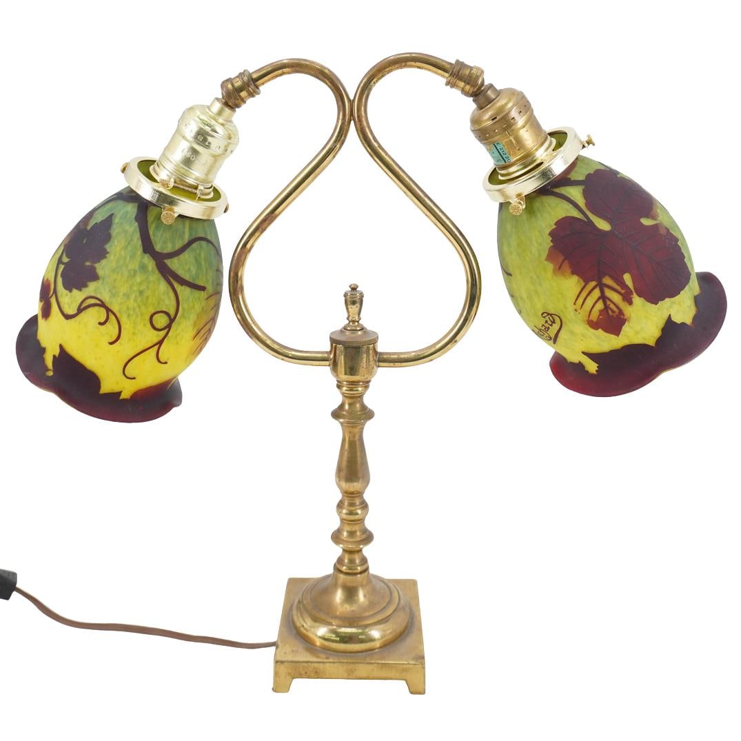 Art Nouveau Loetz Richard Cameo Art Glass Desk Lamp: DESCRIPTION: Art Nouveau Loetz Richard Cameo Art Glass Desk Lamp. With a polished brass body and a pair of Art Nouveau cameo glass tulip shades signed 'Richard', embellished with leaf motifs. Loetz pr