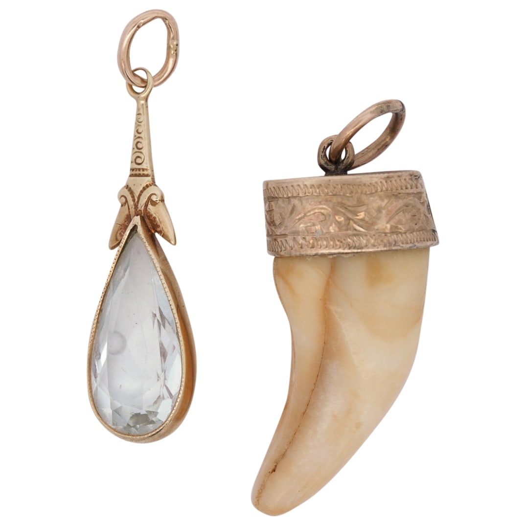 (2 Pc) Antique 14K Gold & Aquamarine Pendant And 10K Gold And Tooth Pendant: DESCRIPTION: Two pendants: one lavalier drop pendant of 14K gold fitted with an aquamarine, one of 10K gold fitted with a beast's tooth. Total weight of both pieces together: 3.4 g. / 2.19 dwt CIRCA: 