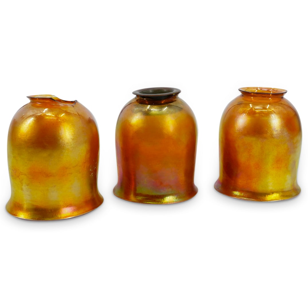 (3 Pc) Tiffany Studios Yellow Favrile Glass Shades: DESCRIPTION: Set of 3 Tiffany Studios yellow favrile glass shades in bell form. Etched signature "L.C.T." CIRCA: Early 20th Century ORIGIN: USA DIMENSIONS: H: 4.75" D: 4" Inner D: 2.125" CONDITION: On
