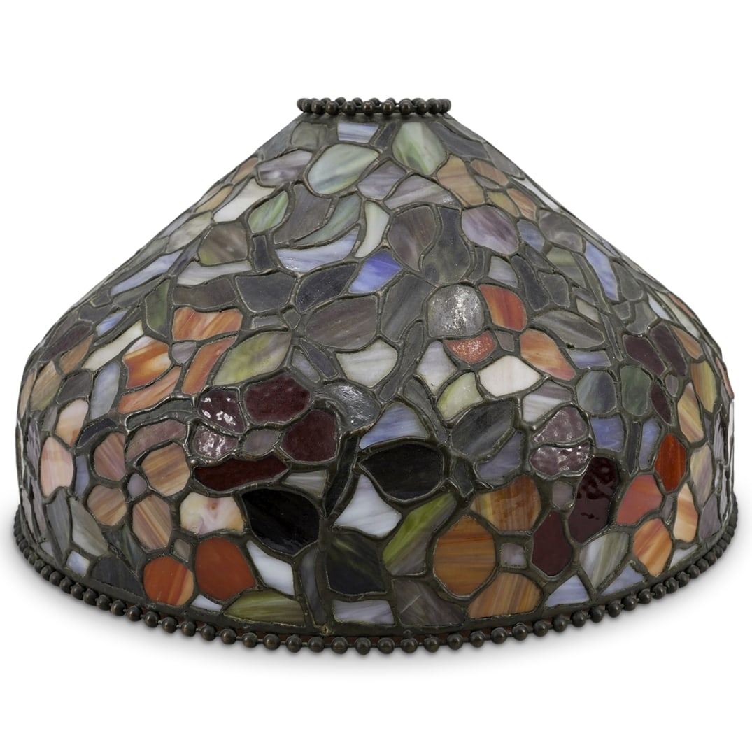 Large Decor Studio Leaded Stained Glass Lamp Shade: DESCRIPTION: Large Decor Studios leaded stained glass lamp shade, featuring various flowers in vibrant colors throughout. Beaded accents on top and bottom trim. Stamped inside shade "Decor Studio NYC 