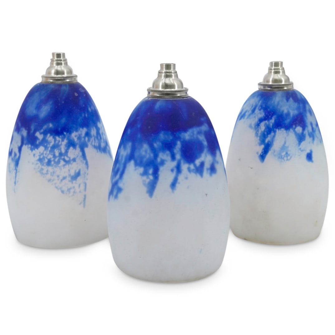 (3 Pc) Vintage Pate de Verre Glass Shades: DESCRIPTION: Set of 3 pate de verre glass shades in white and blue shades. Each have fixture within. CIRCA: 20th Century ORIGIN: France DIMENSIONS: H: 6.5" D: 3.25" CONDITION: Good condition Unless ot