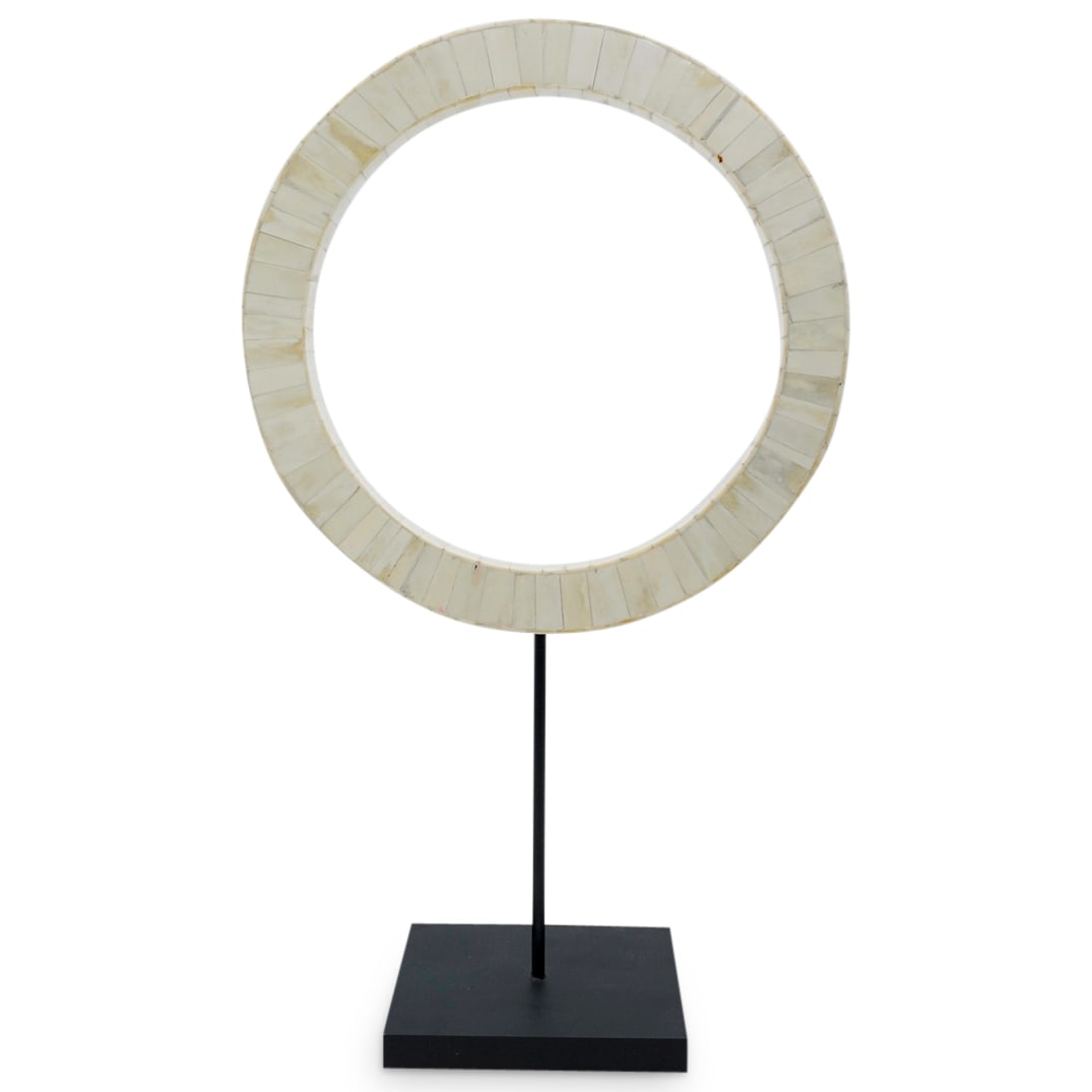 Post Modernist Tessellated Bone Abstract Sculpture: DESCRIPTION: Tessellated bone sculpture by a member of the post-modernist school depicting an abstract ring perched atop a stem on a black, wooden base. CIRCA: Mid-20th Century ORIGIN: Continental DIM
