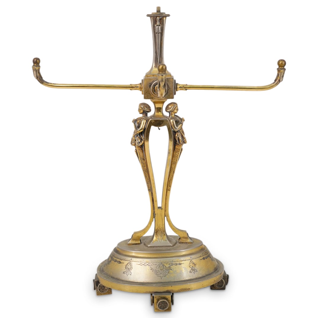 Art Nouveau Signed Gorham Centerpiece Base: DESCRIPTION: Art Nouveau signed Gorham centerpiece metal base with vermeil gold wash finish, designed with a central crystal prism pendant (missing) flanked by a pair of caryatid figurative motifs. Ma