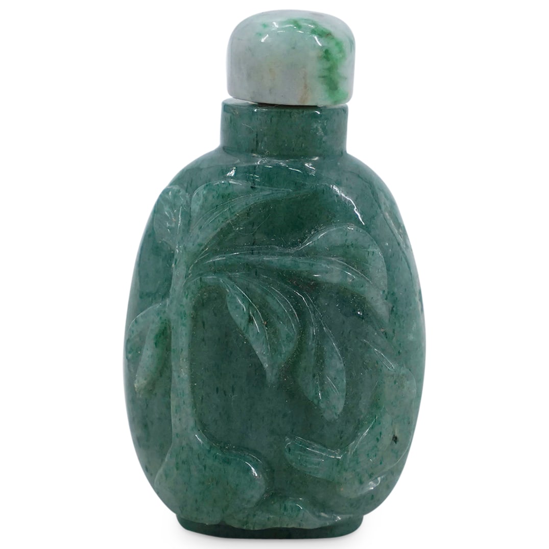 Antique Chinese Carved Aventurine Snuff Bottle: DESCRIPTION: Antique snuff bottle carved from aventurine featuring a relief on one side depicting a songbird beneath a sprig of foliage sprouting from a bulb.CIRCA: 19th CenturyORIGIN: ChinaDIMENSIONS