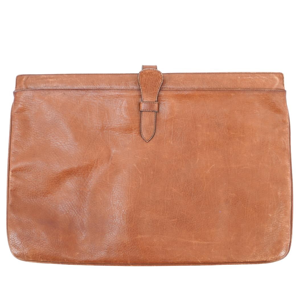 Vintage Salvatore Ferragamo Envelope Leather Bag: DESCRIPTION: Vintage Salvatore Ferragamo Envelope Leather Bag. In natural brown hued leather. With zippered closure, and additional Salvatore Ferragamo mark.CIRCA: 1970sORIGIN: ItalyDIMENSIONS: H: 10"