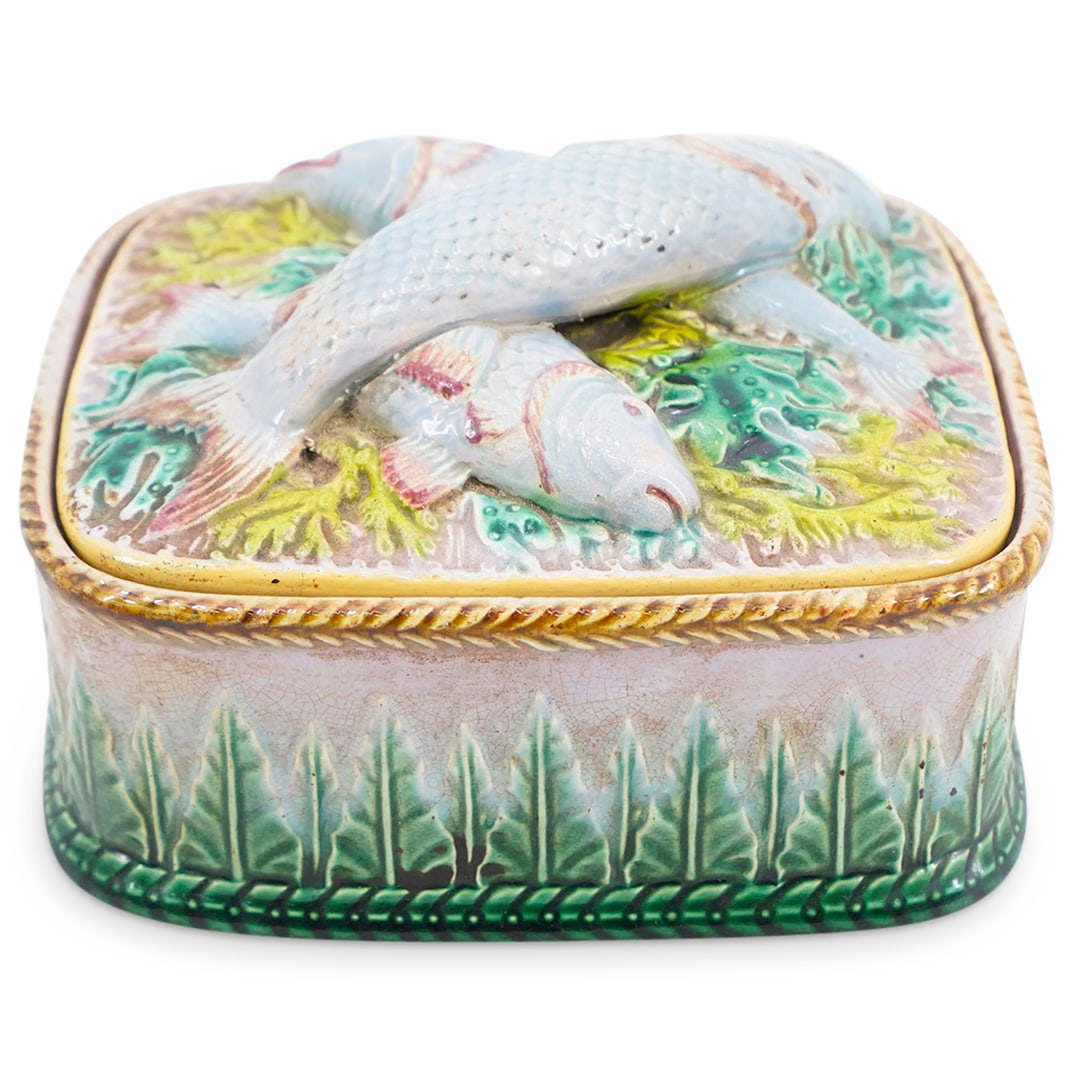 19th Century George Jones Majolica Sardines Lidded Box: DESCRIPTION: Antique lidded majolica box by George Jones featuring a fish and aquatic plant design in relief on the lid and a pointed leaf relief around the side.CIRCA: Mid-to-late 19th CenturyORIGIN: