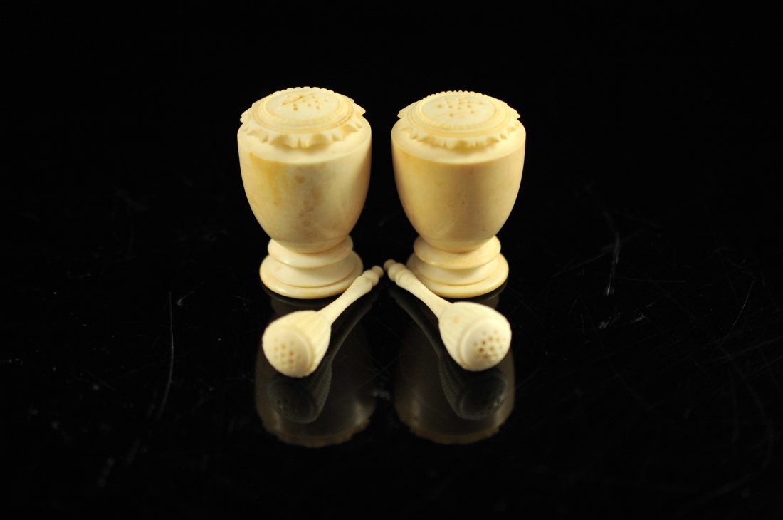 Two pairs of Chinese antique carved ivory salt sell: DESCRIPTION: Two pairs of antique hand carved ivory salt sellers. First pair have a handle and beehive design, second pair are freestanding matching machine turned with a sun burst top design. Chipped