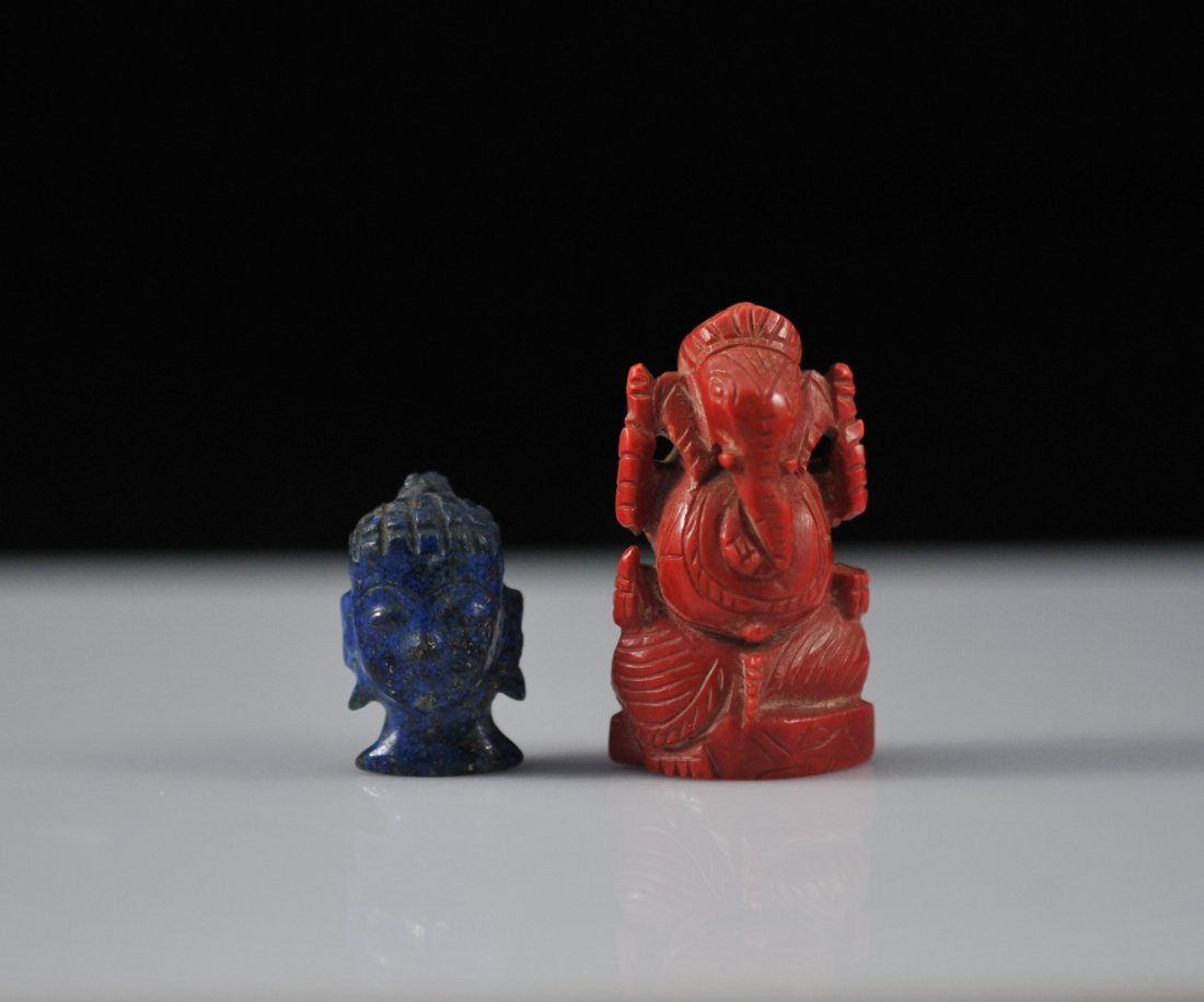 Antique lot of two carved coral and lapis lazuli fi: DESCRIPTION: Lot of two antique hand carved stone figures. First figure is a lapis lazuli carving of the head of an Indian God. Second figure is a coral carving of Ganesh. Both in great condition CIRC