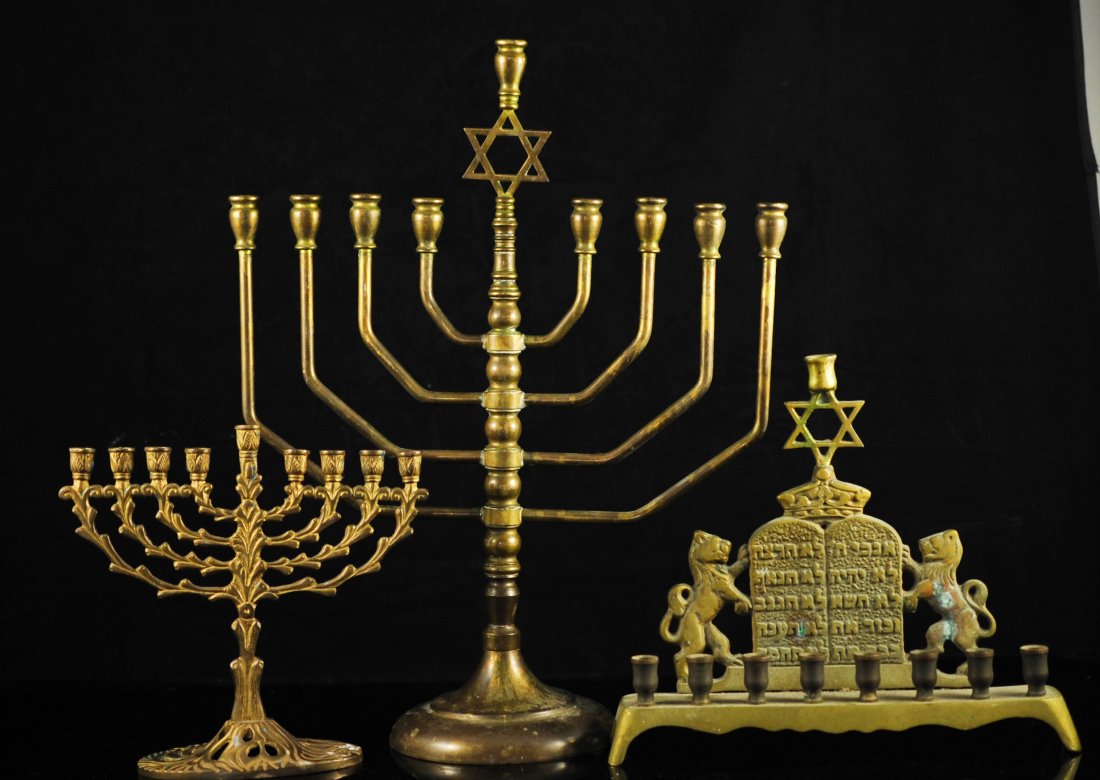 Lot of three vintage brass menorahs: DESCRIPTION: One lot of three vintage brass menorahs. Each different in size, the tallest one has a machine turned body with a Star of David topper, the second menorah features a tree branch design wi