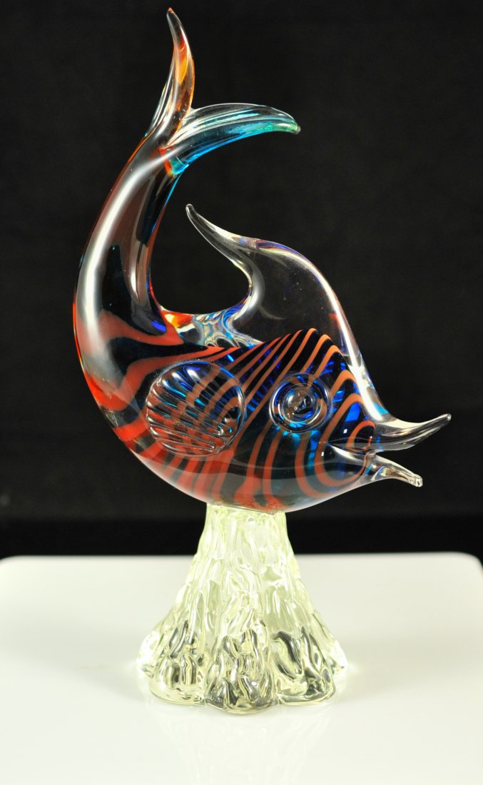 Murano glass multi colored fish. Mint: DESCRIPTION: Murano art glass multi colored fish. Features a clear exterior with a blue and red striped interior. Beautiful vibrant colors. Stands a top a glass rock work base. CIRCA: 1980's ORIGIN: I