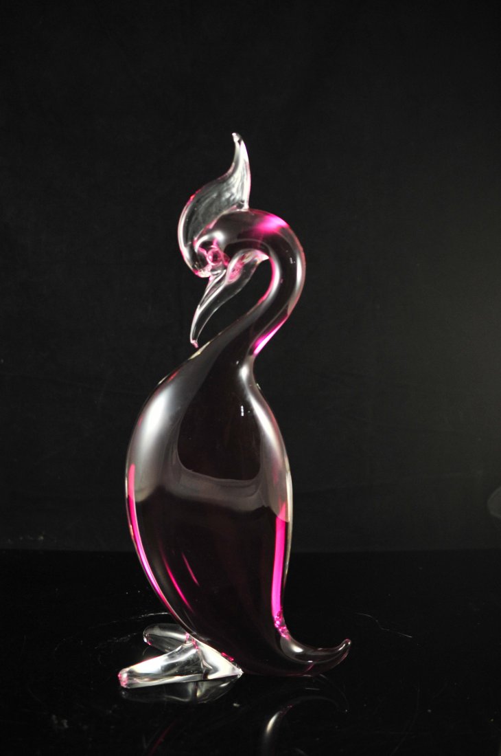 Large burgundy contemporary Murano glass bird: DESCRIPTION: Large burgundy contemporary Murano glass bird. Hand blown art glass design with a wide body base, hooked beak and head feathers. Clear glass exterior with a deep burgundy interior color. 