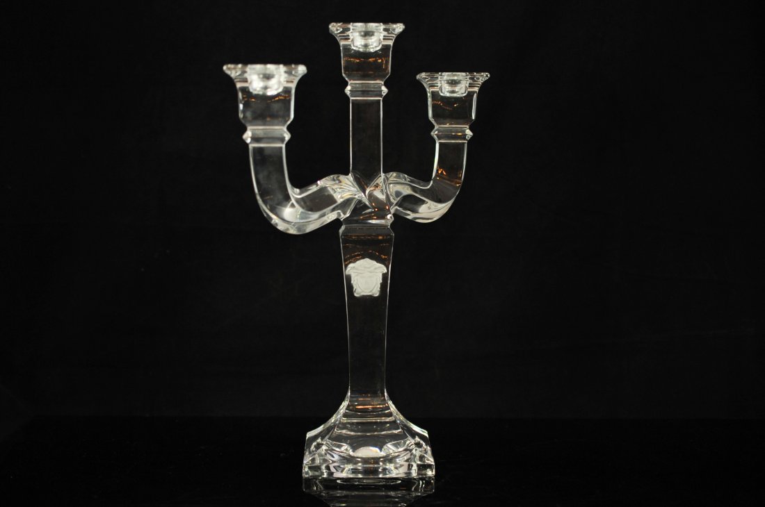 Versace by Rosenthal crystal candelabra. Signed: DESCRIPTION: Versace by Rosenthal crystal candelabra. Solid crystal body with three arms. Features double frosted Medusa heads on the shaft. Absolutely perfect. Mint. Signed "Rosenthal Versace". CIRCA