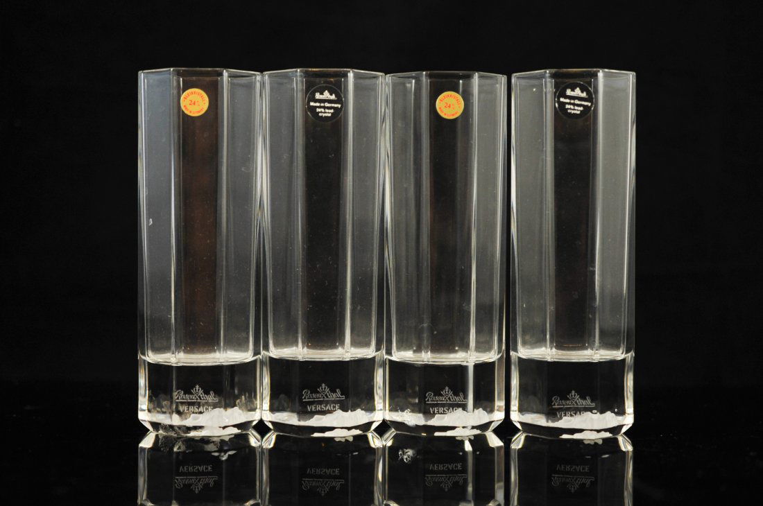 Set of four Versace by Rosenthal highball glasses: DESCRIPTION: Set of four Versace by Rosenthal highball glasses. Clear crystal octagon design. Each glass features the frosted Medusa logo on the bottom. Signed "Rosenthal Versace" on the side on each
