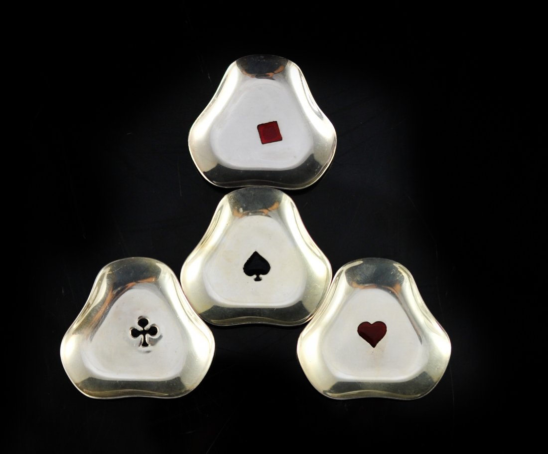 Set of four sterling and enamel Danish coasters: DESCRIPTION: Set of four sterling and enamel Danish coasters. Each one has a center black or red enamel design (Heart, spade, club, and diamond). Clover style body design. Hallmarked "Denmark" with Da