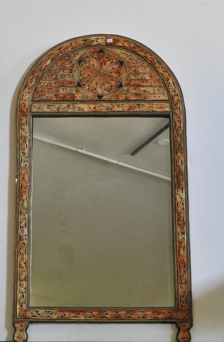 Antique Moroccan mirror with bone tiles: DESCRIPTION: Antique Moroccan mirror with bone tiles. Features hand carved bone tiles throughout the whole piece. Intricately hand carved with a weathered patina. Brass bands in between the bone tiles