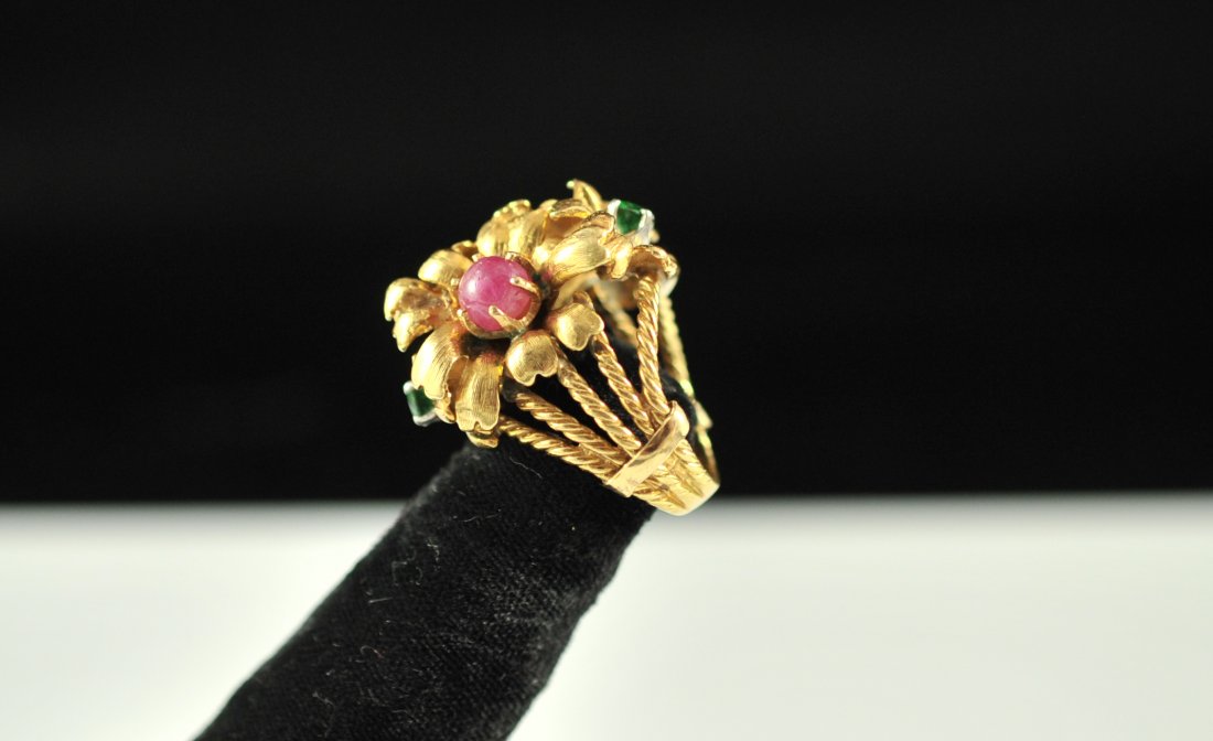 Vintage French 18k multi stone floral evening ring: DESCRIPTION: Vintage French 18k multi stone floral evening ring. Boasts an immaculate floral design with four flowers crafted from solid 18k yellow gold. at the center of each flower is a precious sto