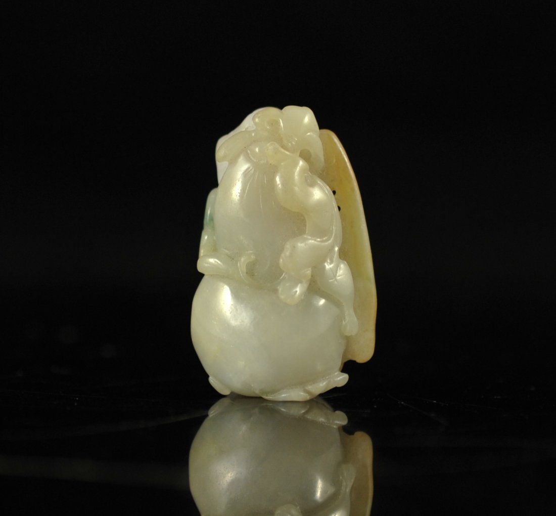 Chinese carved white jade panther pendant: DESCRIPTION: Chinese carved white jade panther pendant. Spectacular carving of a panther on a rock work pendant. Beautiful white tones with hints of yellow and hunter green. Perfect condition CIRCA: E