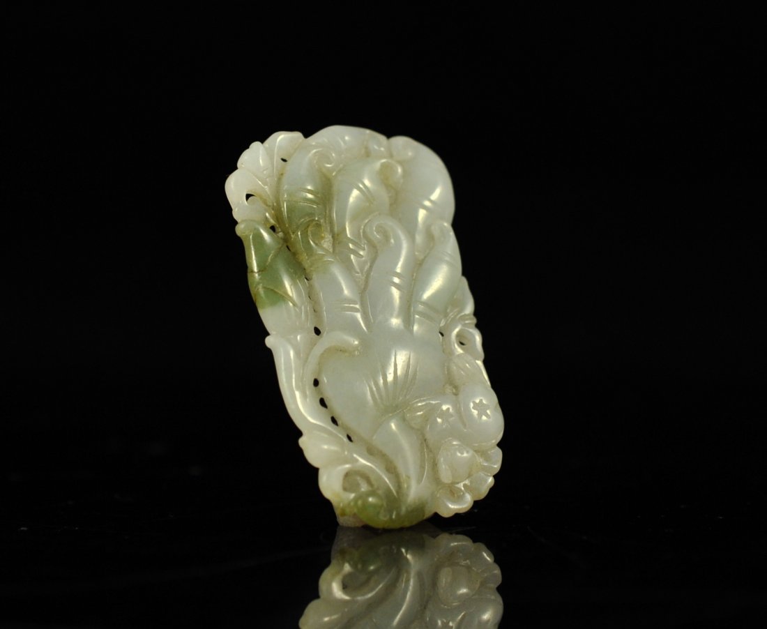 Antique white jade jungle cat hand carved pendant: DESCRIPTION: Antique white jade jungle cat hand carved pendant. Exquisite hand carved white jade pendant featuring a jungle cat perched up high with decorative elephant trunks throughout the entire pi