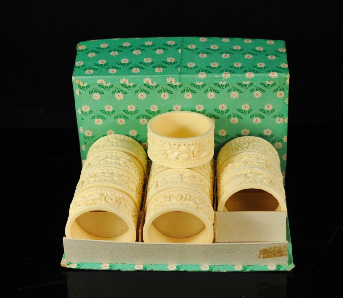Set of twelve vintage carved ivory napkin rings: DESCRIPTION: Set of twelve vintage Chinese carved ivory napkin rings. Beautiful hand carved ivory napkin rings featuring a floral motif with a blank name plate on each ready to be engraved. Each ivory