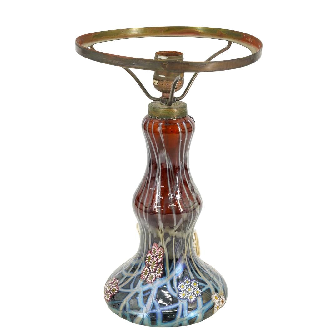 Murrine Glass Desk Lamp: DESCRIPTION: Art glass desk lamp, possibly Murano, decorated with iridescent lines and clusters of polychrome floral murrine canes. CIRCA: 20th century ORIGIN: Possibly Italian DIMENSIONS: H: 12" Diam