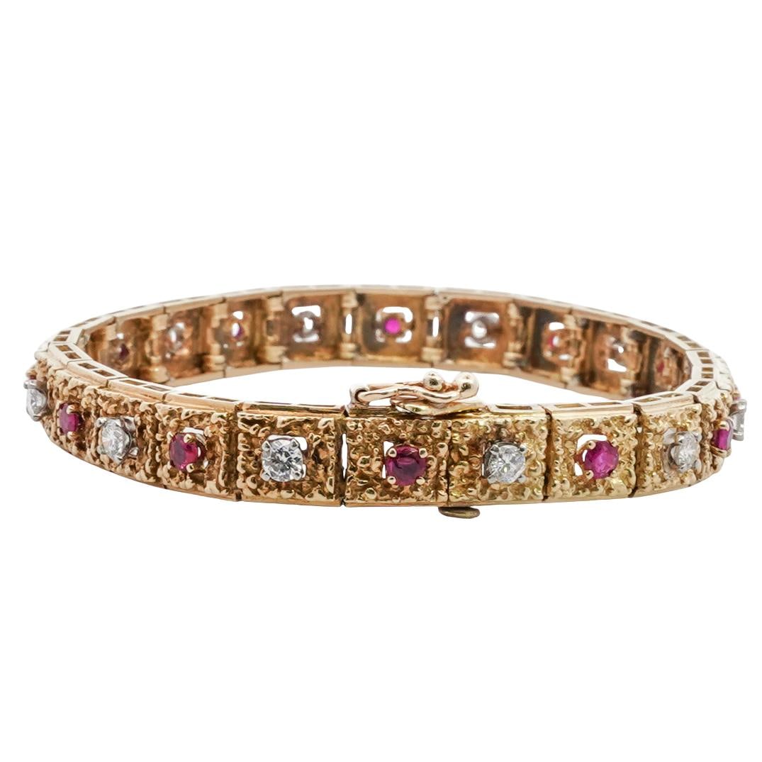 Tiffany & Co. 18k Gold, Ruby, and Diamond Bracelet: DESCRIPTION: Tiffany & Co. collaboration with Hammerman Brothers, 18k gold bracelet, composed of textured gold links, each set alternately with round cut rubies (approx. 1.2 carats) and diamonds (appr