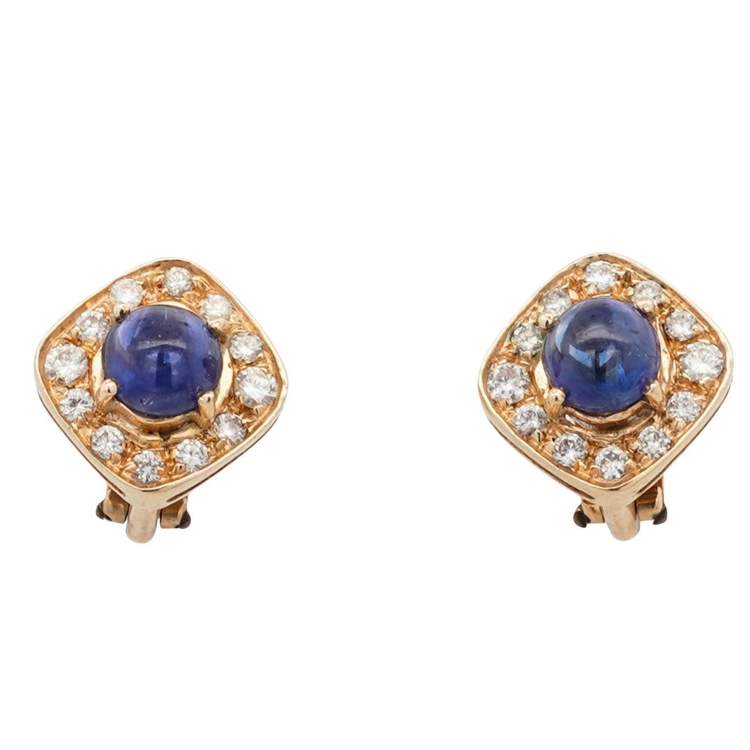Pair 14k Gold, Diamond, and Sapphire Cabochon Earrings: DESCRIPTION: Pair of 14k gold square shaped earrings, featuring a sapphire cabochon at the center of each. The sapphires are surrounded by a halo of diamonds. Total weight: 6.77g (4.35 dwt) CIRCA: 20t