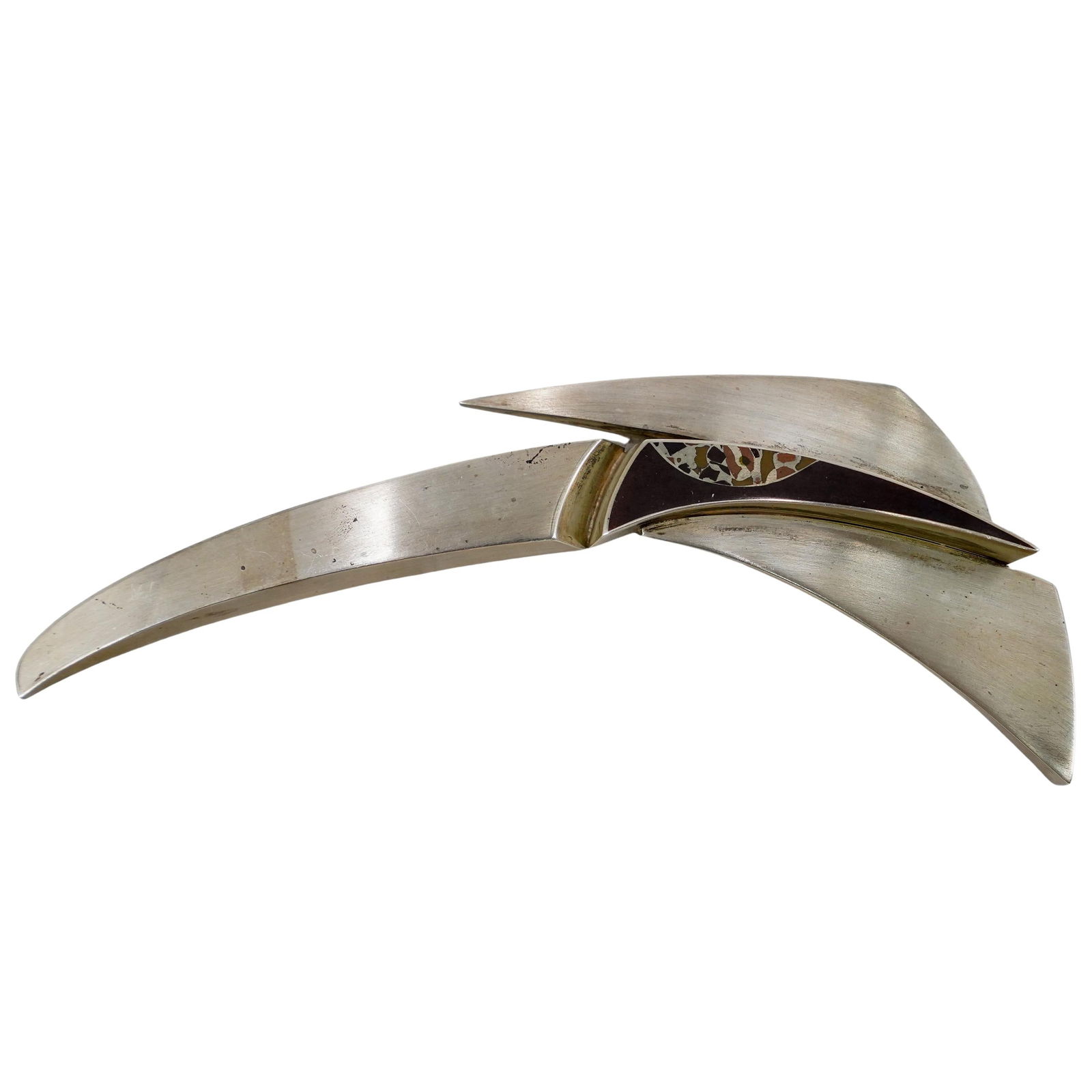 Robert Farrell (American, b. 1960) Sterling Silver Brooch: DESCRIPTION: An artist brooch by Robert Farrell comprised of a sterling silver foundation accented with mixed metal (copper and brass) patterns. Marked "Farrell Sterling". Total Weight: 101. 87 Grams