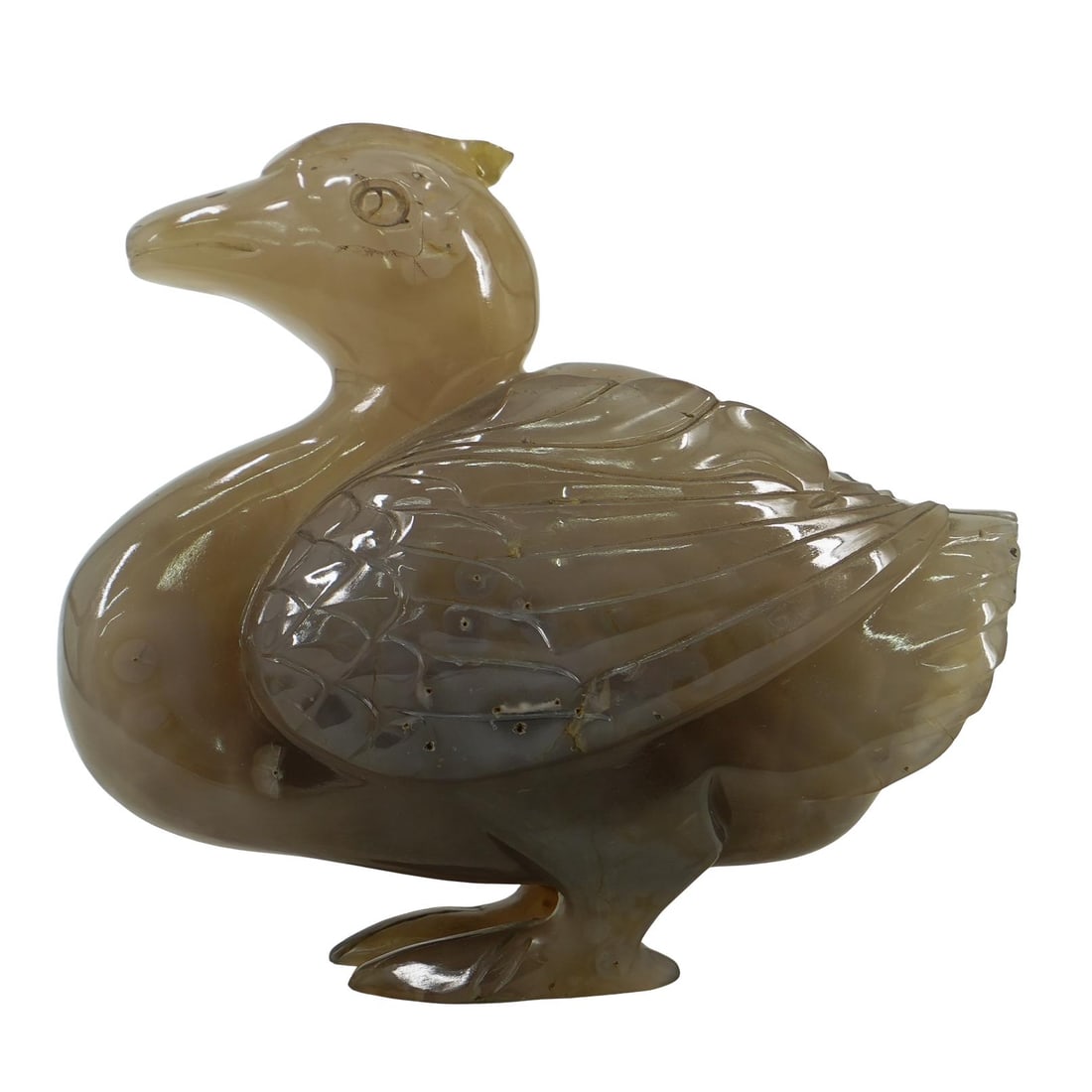 Antique Chinese Qing Dynasty Carved Agate Duck: DESCRIPTION: Carved agate figurine depicting a standing duck. Probably from Qianlong era of Qing dynasty. CIRCA: 18th Century ORIGIN: China DIMENSIONS: H: 5.75" W: 2.5" L: 6.5" CONDITION: Hairline cra