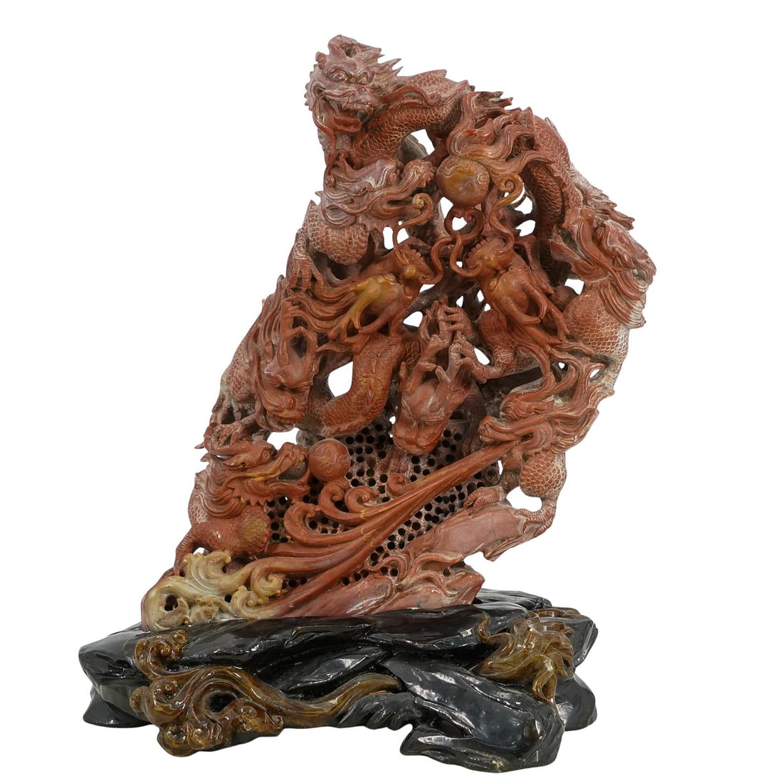 Antique Chinese Finely Carved Dragon Soapstone: DESCRIPTION: Antique Chinese finely carved soapstone sculpture depicting multiple dragons chasing flaming pearls with open-work accents, displayed on a black stone with fiery accents. CIRCA: Early 20t