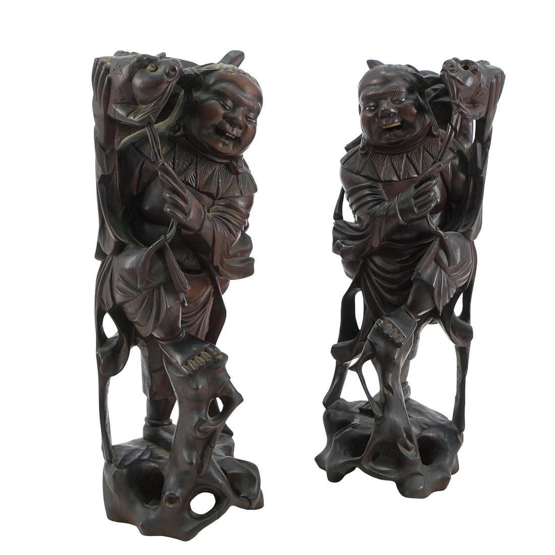 (2 Pc) Japanese Carved Hardwood Fishermen: DESCRIPTION: Pair of Japanese carved hardwood candle or joss stick holders, a pair of grinning men holding up fish and standing on stylized rockery bases carved of a piece with the rest. Each figure i