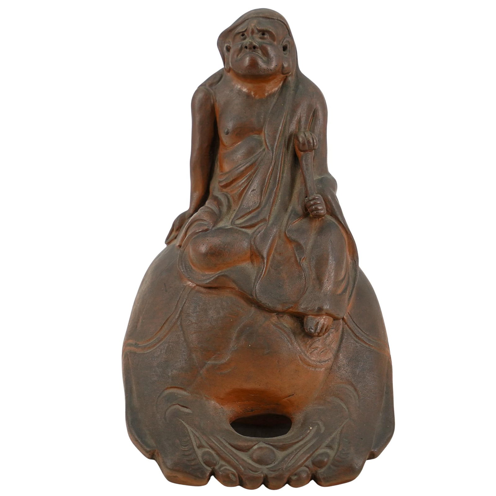 Japanese Earthenware Daruma: DESCRIPTION: Japanese earthenware daruma, seated in a robe on top of a rounded base. Stamped on reverse CIRCA: 19th Century ORIGIN: Japan DIMENSIONS: H: 8" W: 5.75" L: 5.25" CONDITION: Good condition 