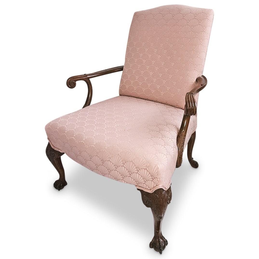 Vintage American Made Mahogany Lounge Armchair: DESCRIPTION: Vintage American made mahogany lounge armchair with custom pink hued fabric upholstery with shell motifs, finished with carved ball and claw feet. CIRCA: 20th Century ORIGIN: USA DIMENSIO