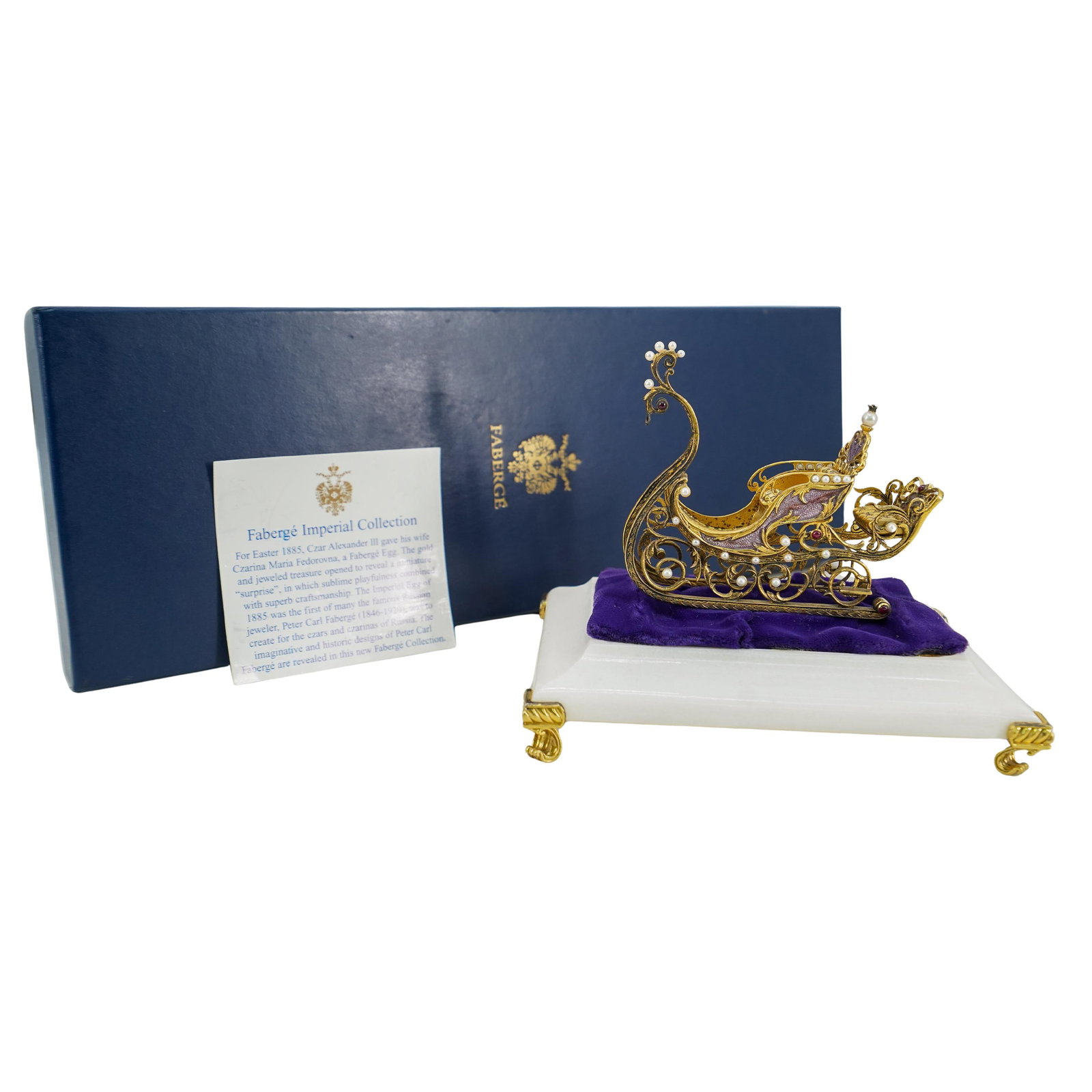 Imperial Faberge Sterling Silver Jeweled Sleigh: DESCRIPTION: Sterling silver "The Imperial Jeweled Sleigh" from the House of Faberge. Marked Sterling Silver Faberge. 1987 The Franklin Mint. With original box. With display stand. Total weight: 130 g