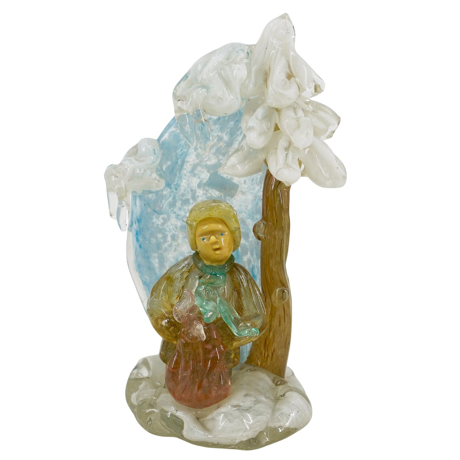 Vintage Murano Glass Boy In Snow Figurine: DESCRIPTION: Vintage Murano glass figurine depicting a boy standing in snow beneath an evergreen tree coated in frost. CIRCA: 20th Century ORIGIN: Italy DIMENSIONS: H: 7.25" W: 3.25" L: 4.25" CONDITIO