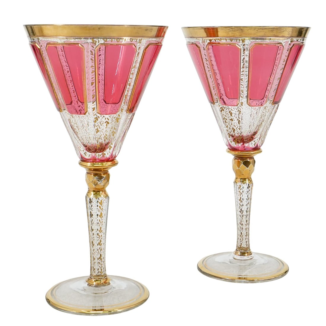 Pair Of Moser Cabochon Cranberry Glass Wine Glasses: DESCRIPTION: Two matching moser wine glasses, each featuring gilt accenting throughout and eight cranberry glass cabochons around its bowl. CIRCA: Late 19th Century ORIGIN: Czechoslovakia DIMENSIONS: 