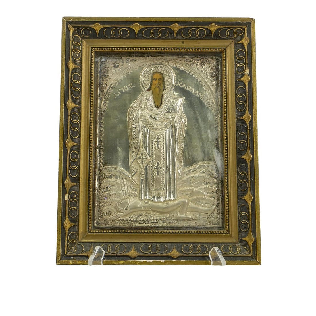 Greek Orthodox Icon of Saint Haralambos: DESCRIPTION: Greek Orthodox icon, depicting Saint Haralambos, in traditional Byzantine style. He is clad in intricate ecclesiastical robes, holding a bible. His name is incised at his sides and framed