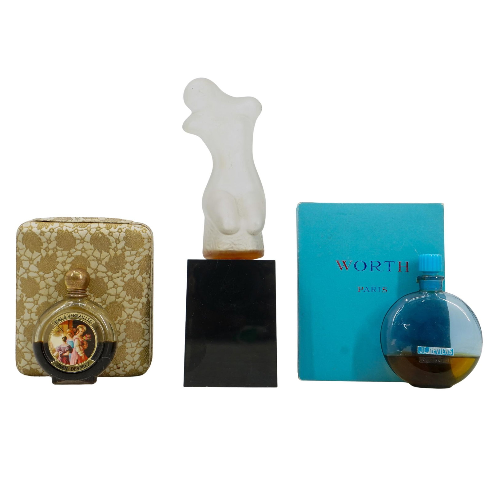 (3 Pc) Vintage Perfume Bottles Assorted Grouping: DESCRIPTION: (3 Pc) Vintage perfume bottles assorted grouping. Includes: (1 Pc) Sculptura by Jovan, art glass spray cologne concentrate bottle, designed with a black base and a clear frosted glass nud