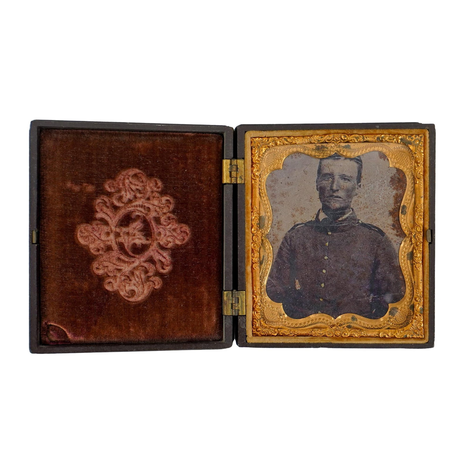 Civil War Soldier Daguerreotype in Gutta Percha Case: DESCRIPTION: Civil War daguerreotype, featuring civil war soldier in uniform in brown gutta percha case. Provenance: Private Pennsylvanian Estate CIRCA: 1860's ORIGIN: USA DIMENSIONS: H: 3.75" W: 0.75
