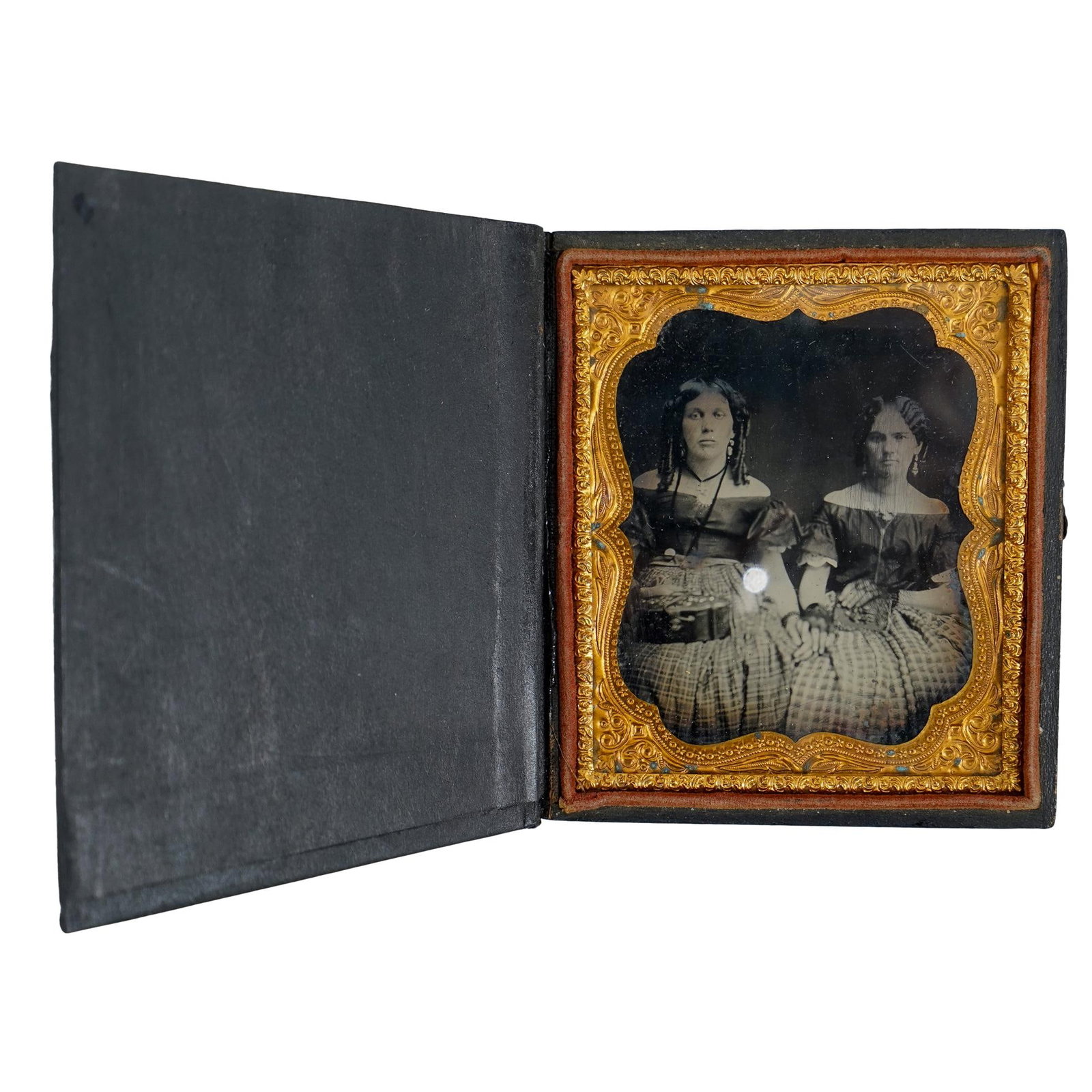 Antique Daguerreotype of Two Sisters: DESCRIPTION: Antique daguerreotype of two sisters, seated next to each other in matching outfits. Housed in leather frame Provenance: Private Pennsylvanian Estate CIRCA: 1860's ORIGIN: USA DIMENSIONS: