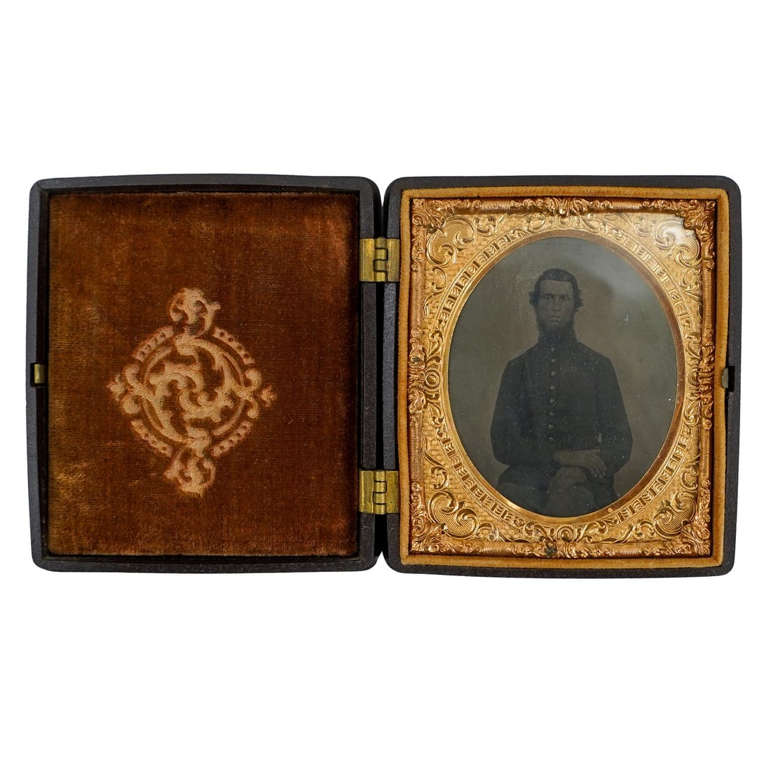 Civil War Soldier Daguerreotype in Gutta Percha Case: DESCRIPTION: Civil war soldier in uniform, housed in gutta percha case with intricate scrollwork in relief on either side. Provenance: Private Pennsylvanian Estate CIRCA: 1860's ORIGIN: USA DIMENSIONS