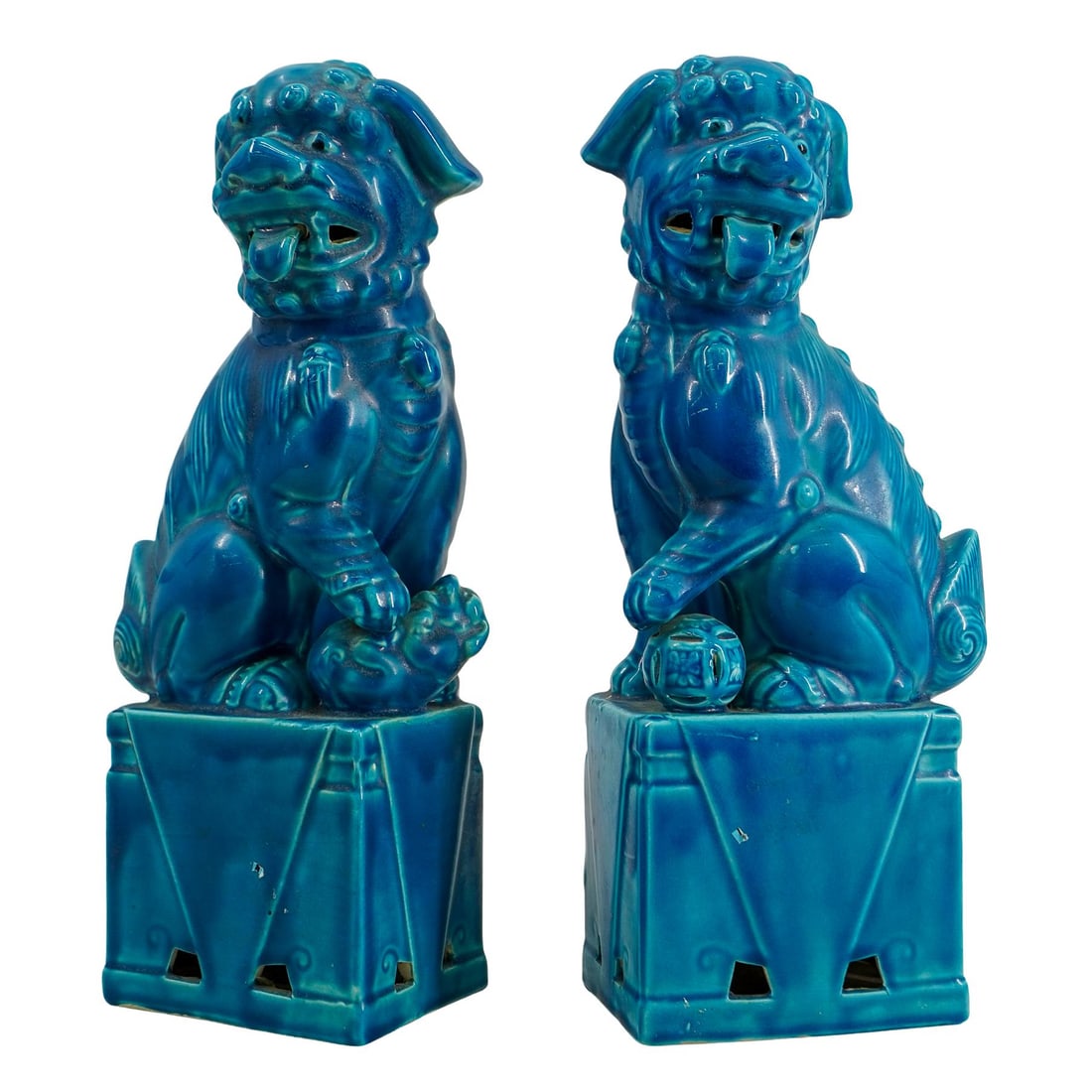 Pair Of Chinese Blue Glazed Porcelain Guardian Lions: DESCRIPTION: Two matching guardian lions - one male holding an embroidered ball beneath his left paw, one female subduing a rambunctious cub beneath her left paw - each standing on a pierced pedestal 