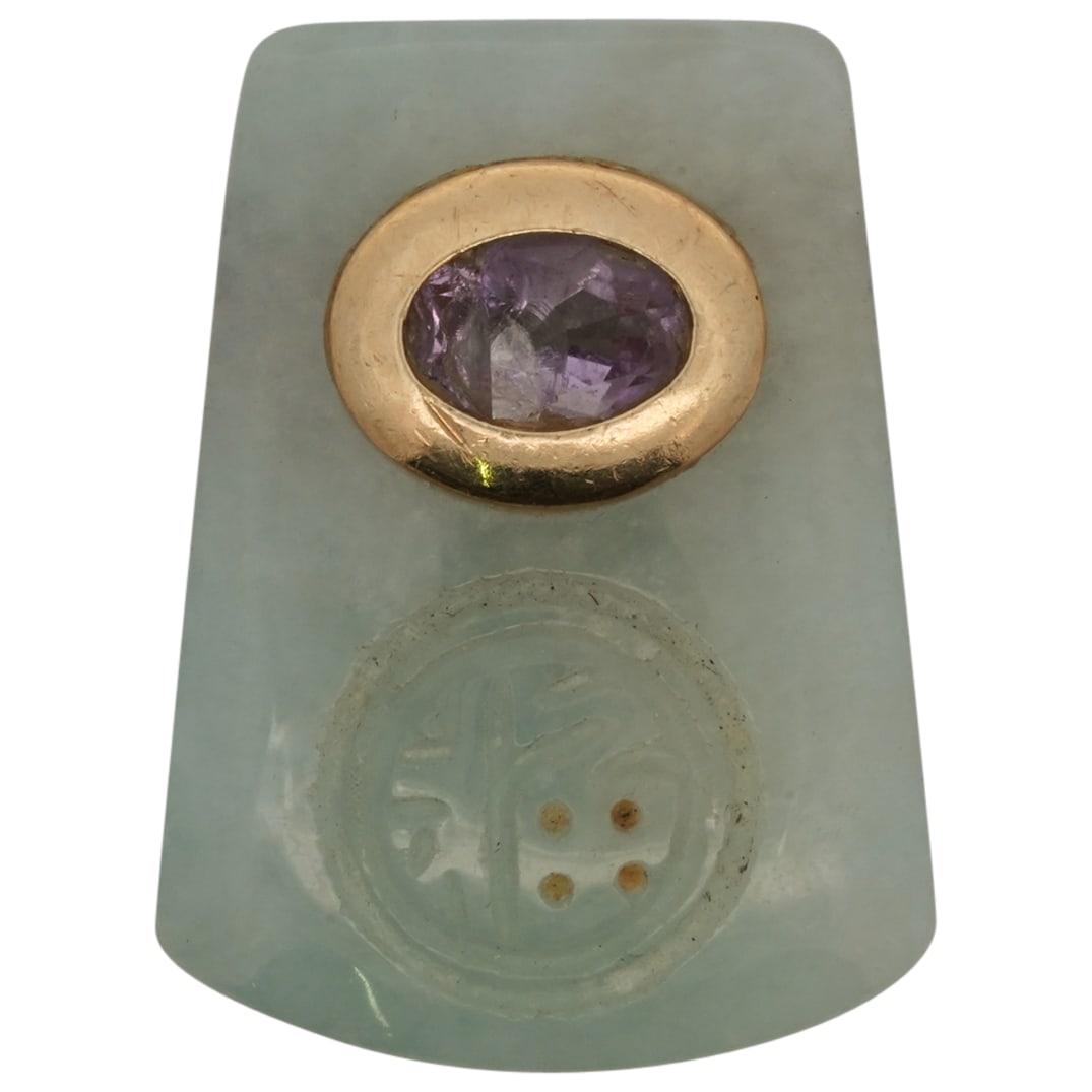 Chinese Jade, 14k Gold, & Amethyst Pendant: DESCRIPTION: Chinese light green jade pendant, featuring oval shaped amethyst stone in 14k gold bezel setting. Under amethyst stone is a carved design. CIRCA: 20th - 21st Century ORIGIN: China DIMENSI