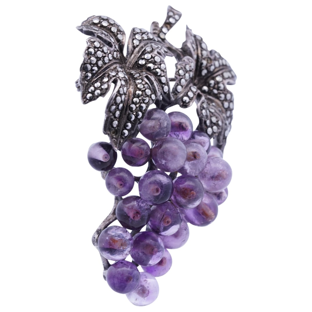 Sterling Silver, Amethyst, & Marcasite Grape Brooch: DESCRIPTION: German grape brooch, the grapes made of small rounded amethyst stones, the leaves crafted from sterling silver with small round cut marcasite stones set throughout. Hallmarked on reverse 