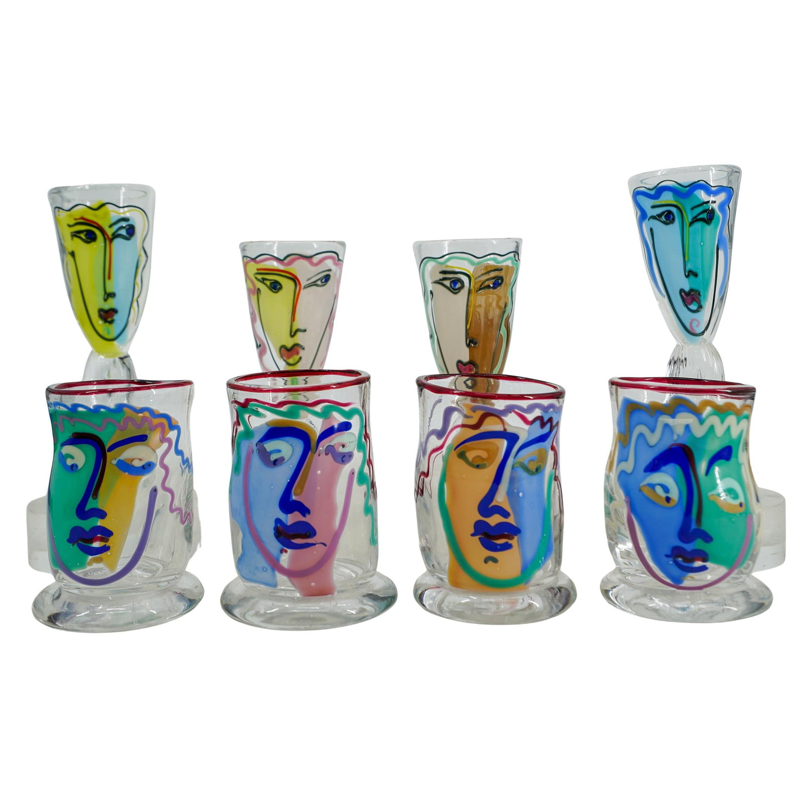 (8Pc) Ricky Bernstein (B. 1952) Art Glass Tumbler & Flute Set: DESCRIPTION: (8pc) Ricky Bernstein (B. 1952) Art glass tumbler and flute set each with polychrome colored faces to clear designs. Incised: 'Bernstein, 1991' & '2012' CIRCA: 1991 ORIGIN: USA DIMENSIONS