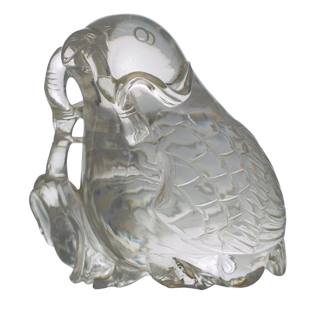 Carved Rock Crystal Bird Figurine: DESCRIPTION: Rock crystal figurine, depicting a carved bird holding a branch in its mouth that leads to the baby bird holding the same branch. CIRCA: 20th Century ORIGIN: DIMENSIONS: H: 5.25" W: 3" L:
