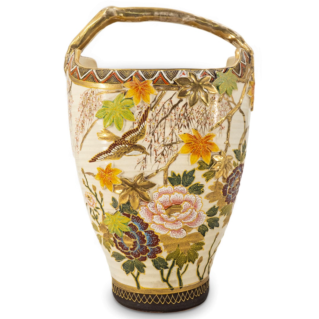 Satsuma Porcelain Basket Vase: DESCRIPTION: Satsuma porcelain basket form vase featuring a branch form handle and enameled bird and textured floral and foliage designs around its body. Finished with gilt accenting throughout. Marke