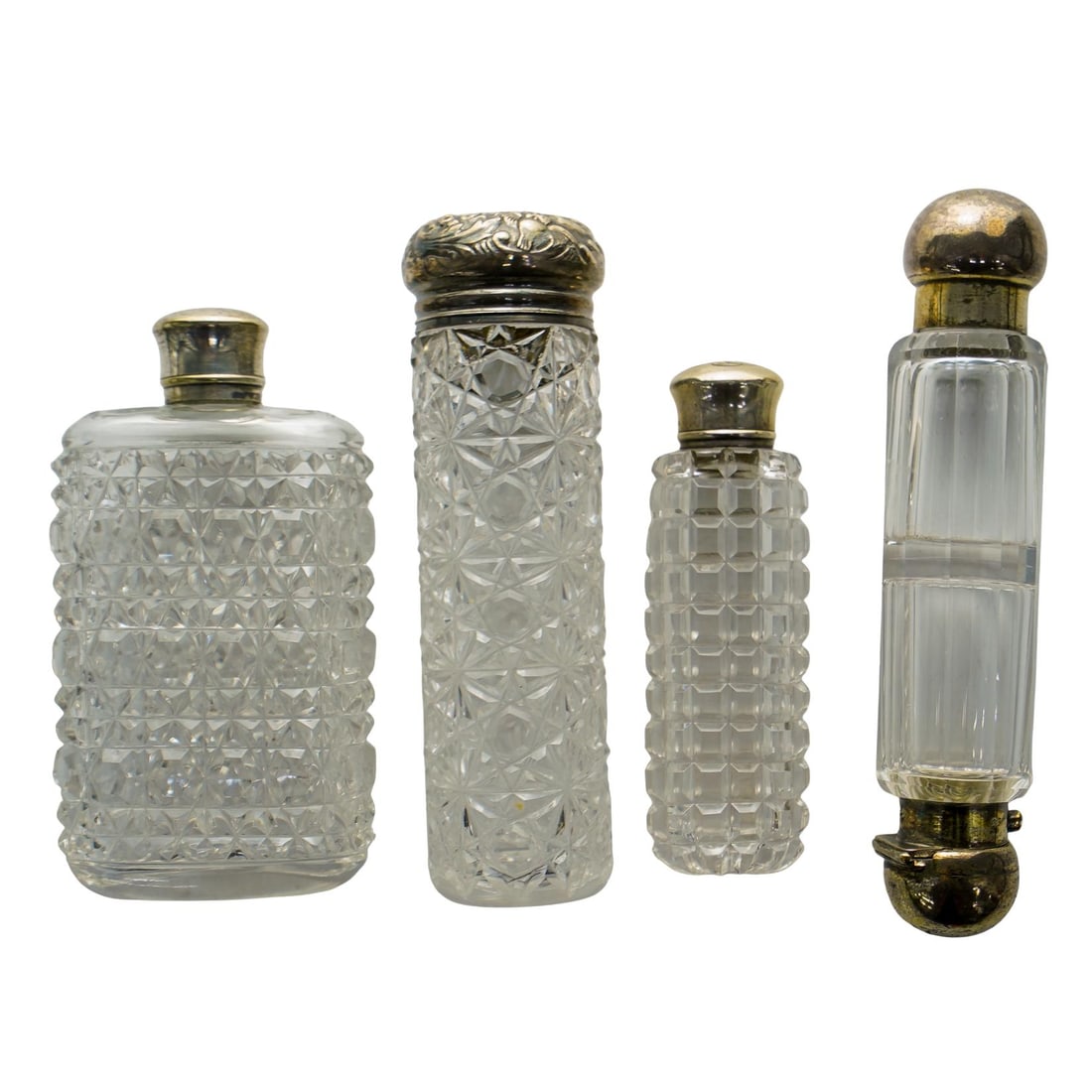 (4 Pc) Antique Cut Crystal Perfume Flasks: DESCRIPTION: Set of 4 antique cut crystal perfume flasks, one featuring a rectangular shape, one featuring an elongated slim rectangular shape with sterling & engraved topper, and one featuring a doub