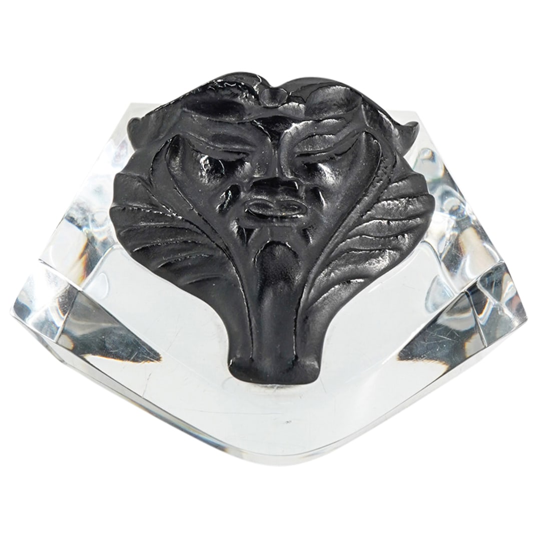 Lalique Crystal Black Satyr Mask Paperweight: DESCRIPTION: Lalique Crystal Black Satyr Mask Paperweight. Marked "Lalique France". CIRCA: 20th Century ORIGIN: France DIMENSIONS: W: 4 1/4" H: 2 1/2" CONDITION: Good condition Unless otherwise stated