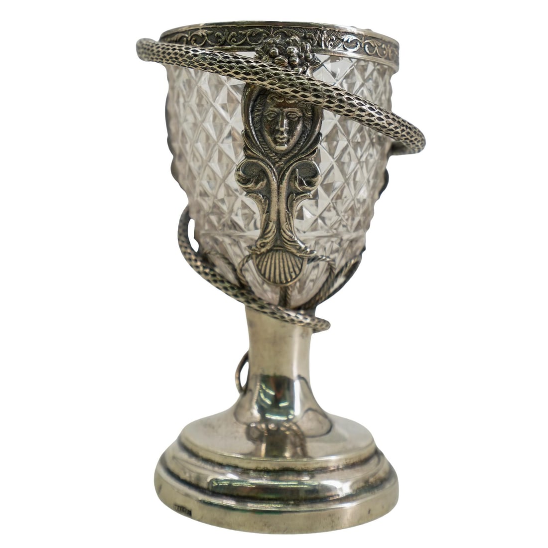 Antique Sterling Silver, Mixed Metal, And Cut Glass Serpent Chalice: DESCRIPTION: Antique chalice composed of a sterling silver base supporting a mixed metal frame housing a cut glass bowl and wrapped with a textured snake. Hallmarked illegibly on foot. CIRCA: 19th to